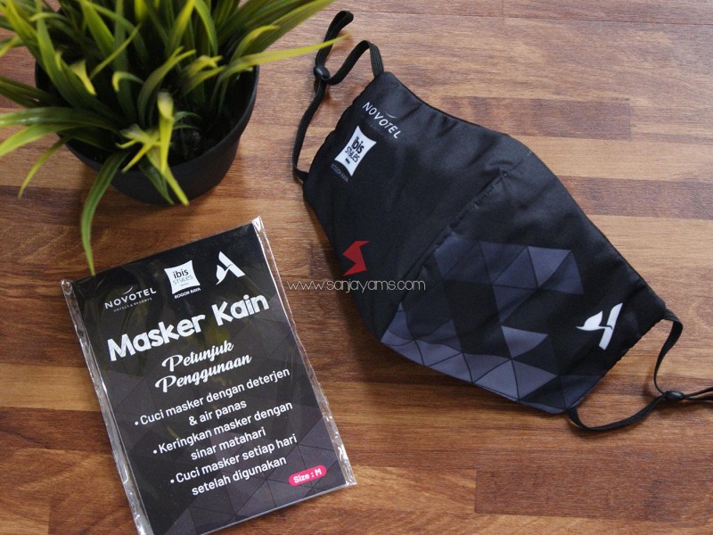 Cetak Masker Kain Printing Premium Ibis Hotel dengan Stopper